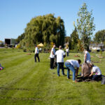 http://People%20planting%20trees%20in%20a%20green%20space.