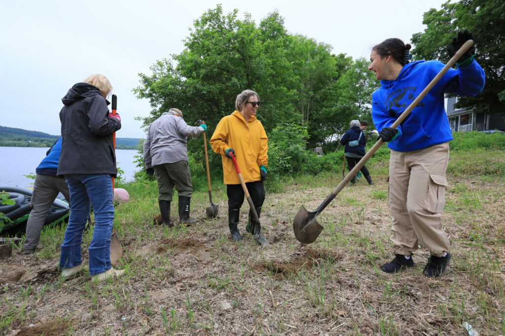 Volunteers digging holes
