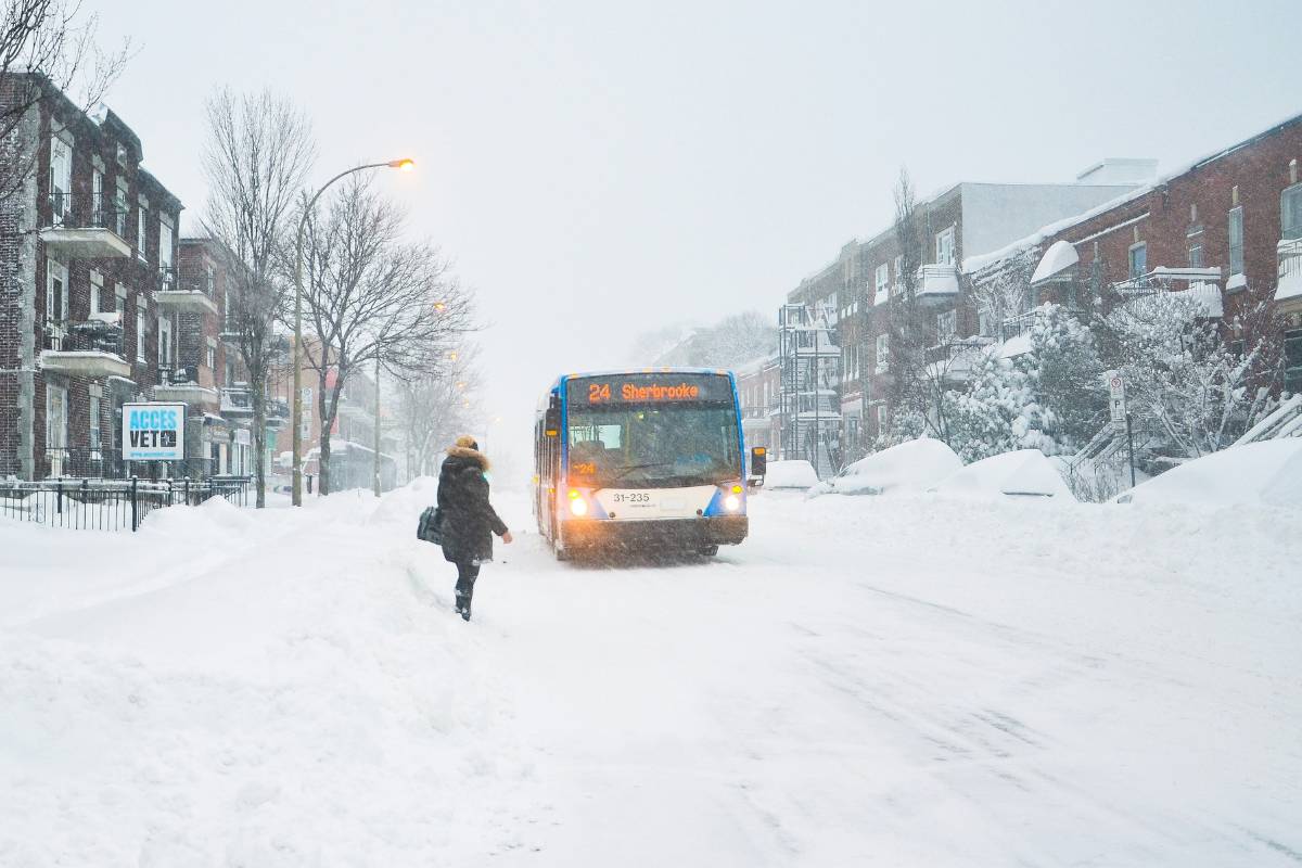 bus picking up passenger in winter in canada
