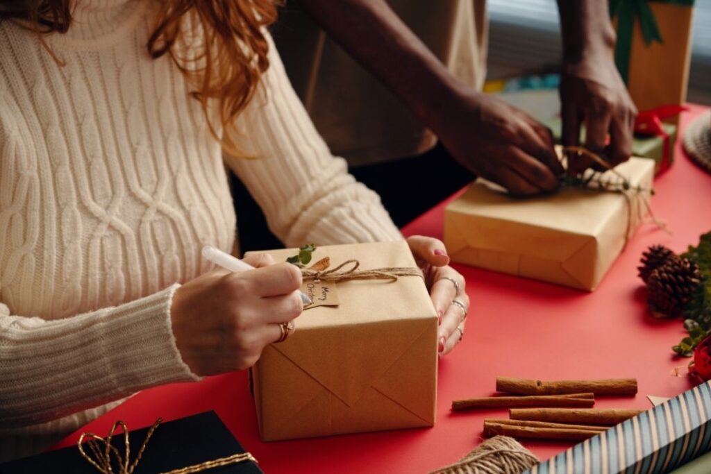 couple wrapping holiday gifts